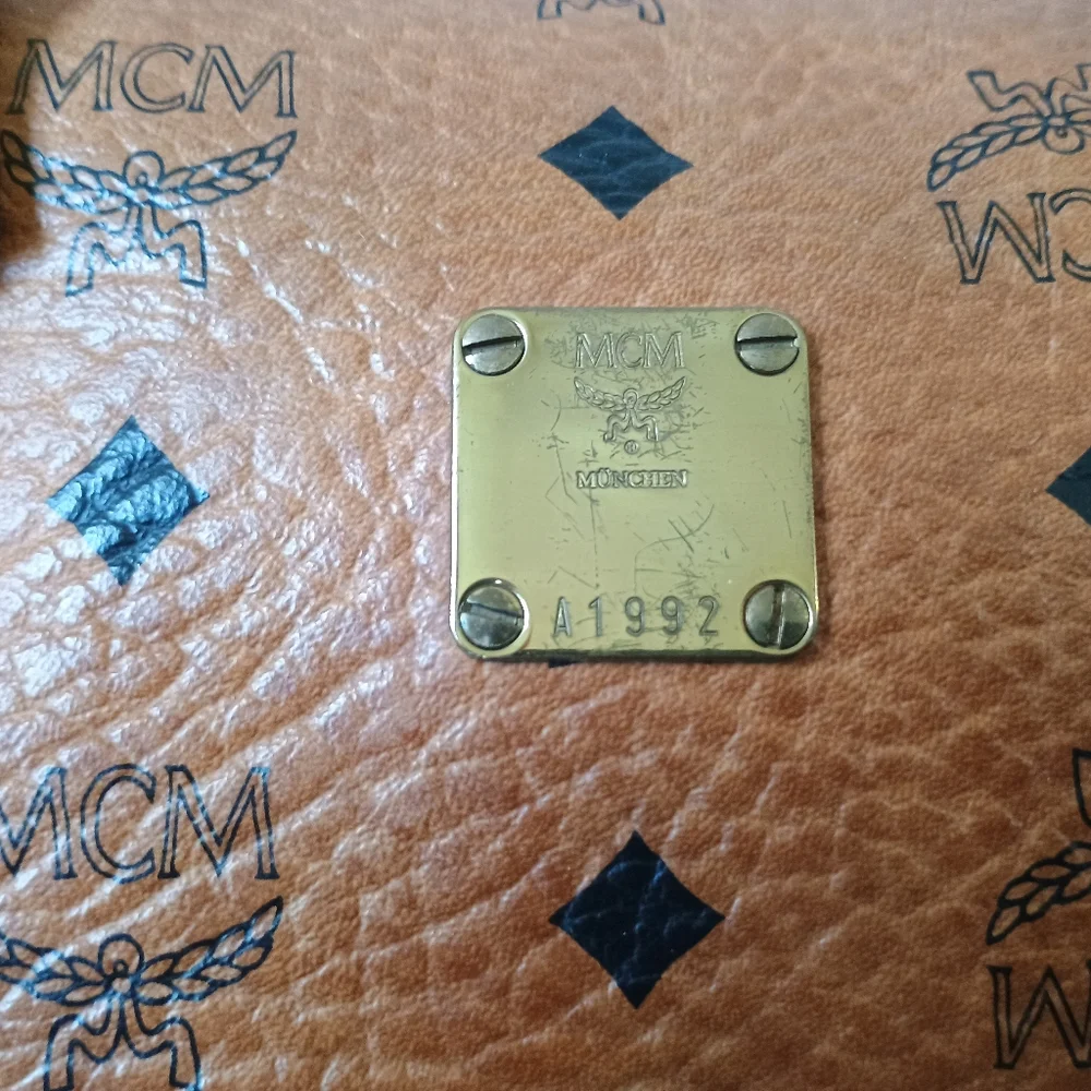 MCM Cognac Brown Monogram Handbag with Black Diamond Motif and Gold Hardware